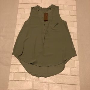 Green sleeveless blouse